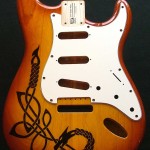 Celtic dragon design woodburned on guitar body with optional pick guard