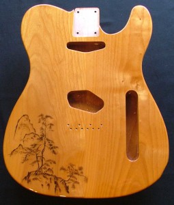 Traditional Japanese landscape design woodburned on guitar body