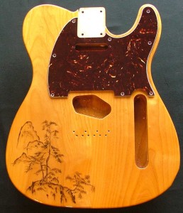Traditional Japanese landscape design woodburned on guitar body with optional pick guard