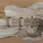 SOLD - Full view of koi fish woodburned on spalted maple guitar body - commissioned piece