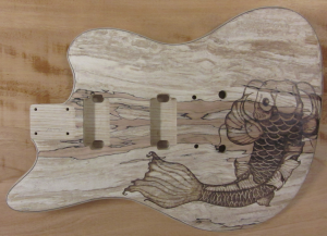 SOLD - Full view of koi fish woodburned on spalted maple guitar body - commissioned piece